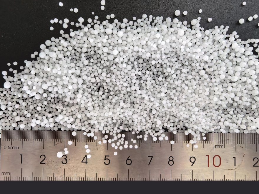 Prilled urea shown against a millimetre ruler